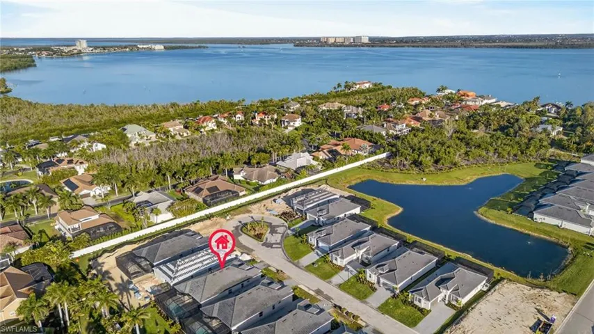 Aerial perspective of suburban area with a large body of water