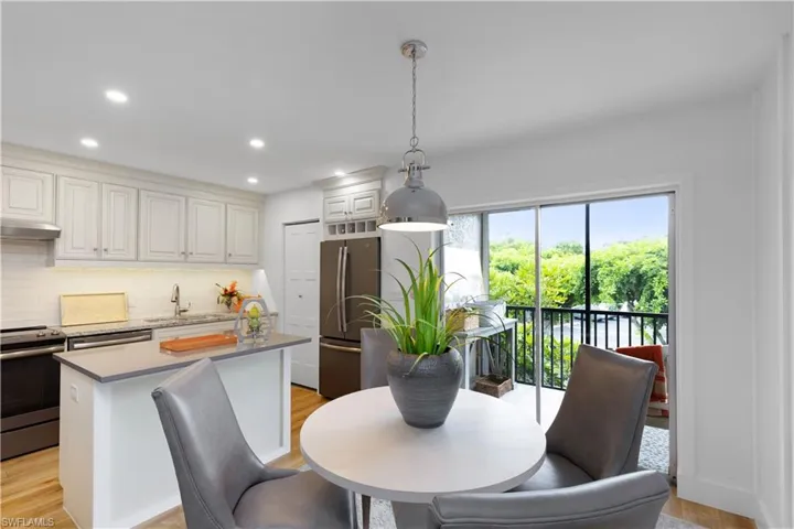 Dining room with light hardwood / wood-style flooring and sink