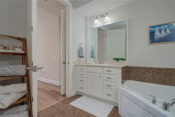 Primary bathroom has a soaking tub, double vanities, and shower