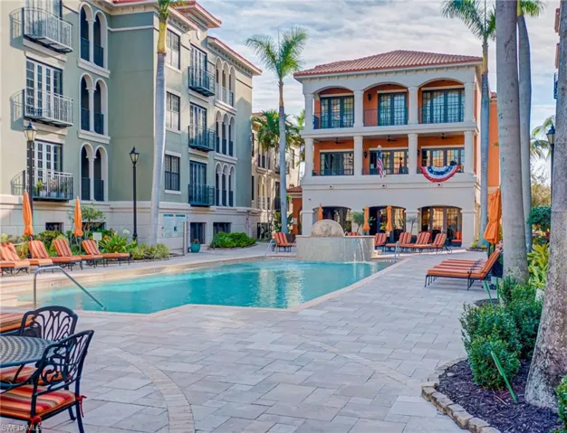 Community pool with a patio