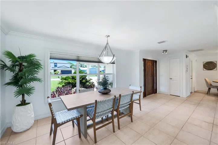 Dining area adjacent to the family room.  Breakfast nook/bar area to the right.