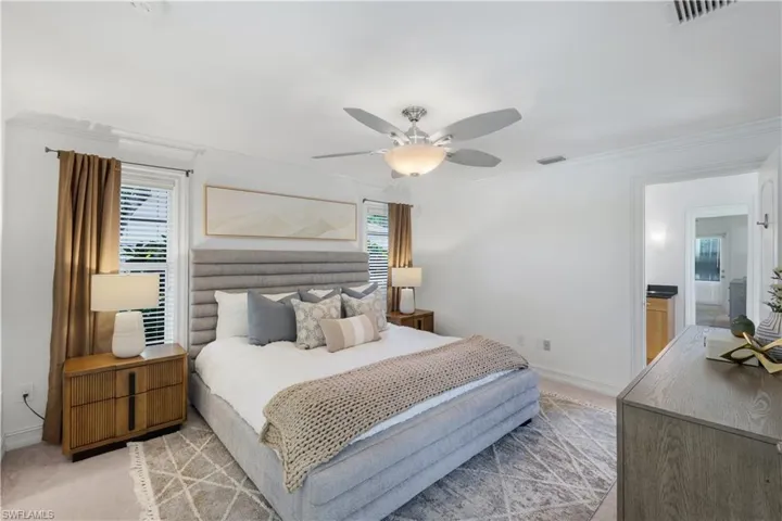 Primary bedroom with en suite bathroom access and large walk-in closet (not shown).