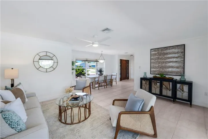 Living room with view of the dining area and front door access.   The master bedroom is to the left (not shown).