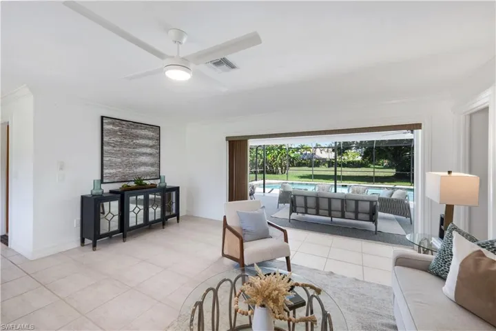 Living room with view of the dining area and front door access.   The master bedroom is to the right (not shown).