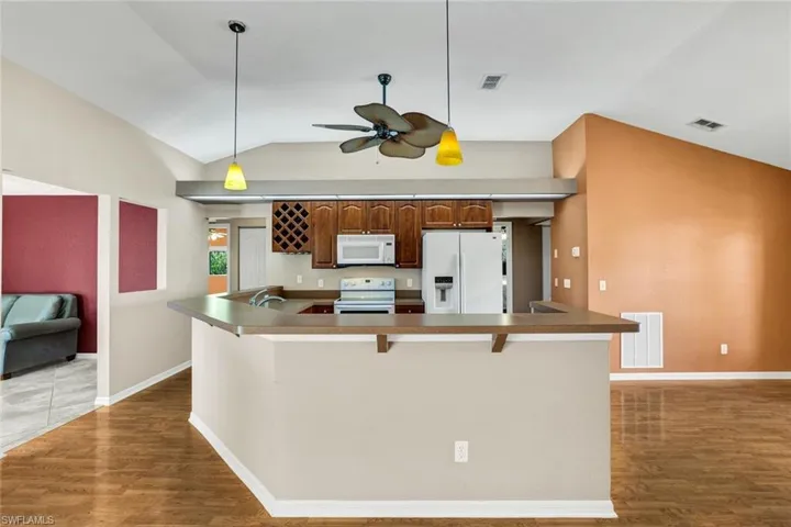 Kitchen offers plenty of counter seating - and don't miss the full dining room area for more seating.