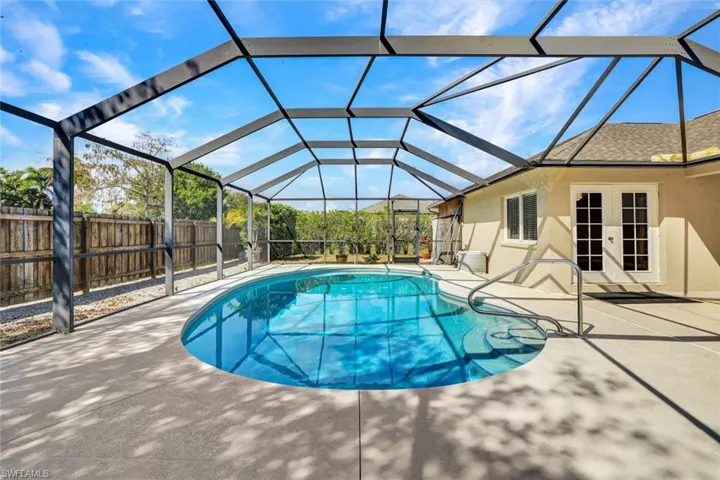 Beautiful back space with screened lanai and pool.