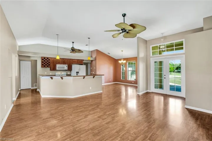 Open layout with vaulted ceiling.
