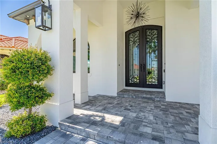 Property entrance featuring french doors