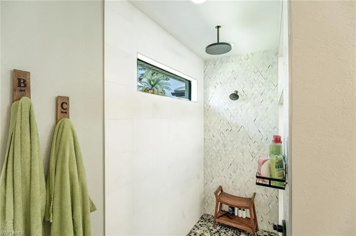 Bathroom featuring tiled shower