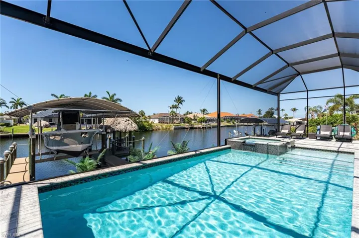 View of swimming pool which features a spa.