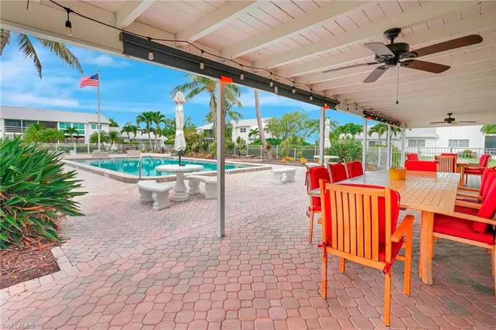 View of patio featuring a ceiling fan and outdoor dining area