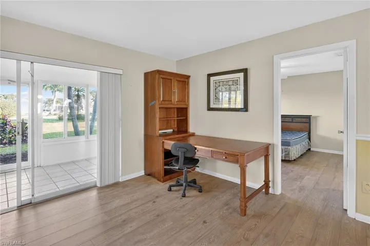 Office area with light wood-style flooring