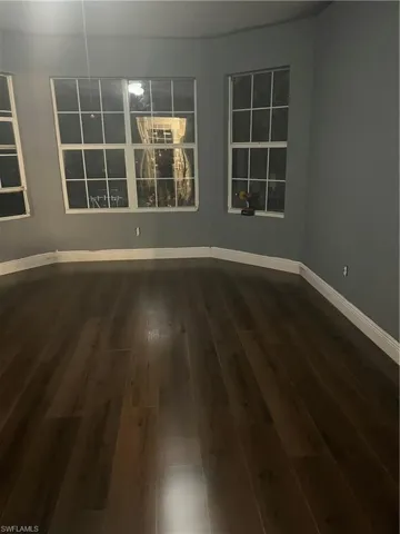 Spare room with hardwood / wood-style floors