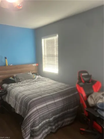 Bedroom featuring hardwood / wood-style flooring