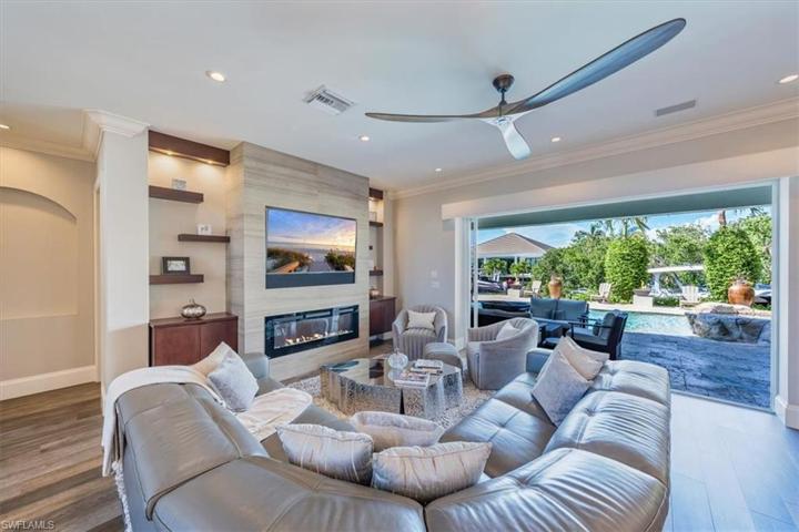 Great room with pocketing sliding doors leading to outdoor entertainment area