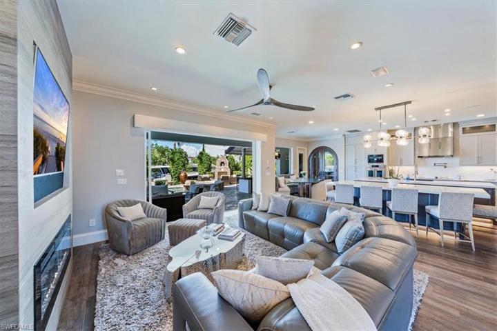 Great room with seamless connection to both indoor and outdoor kitchens