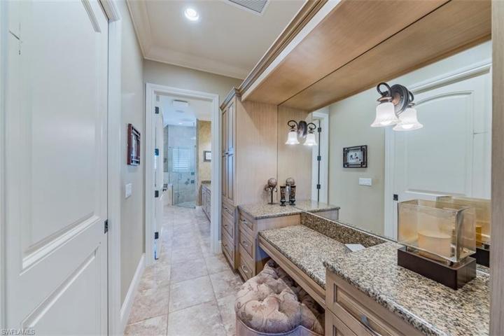 Primary Bedroom Vanity dressing area and access to oversized walk-in closet