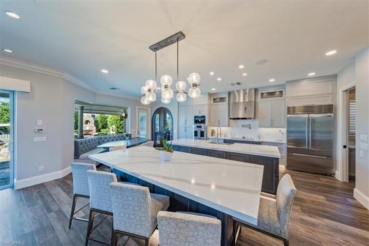 Dual islands offer ample preparation space and seating for 6+