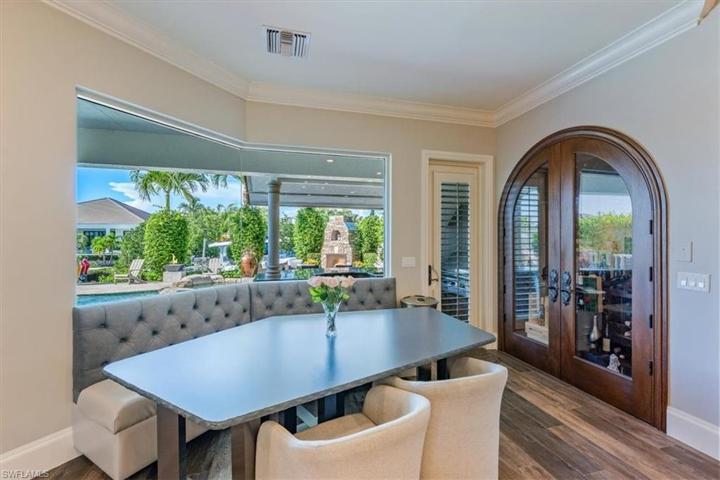 Custom dining table & banquette PLUS 250 bottle wine cellar