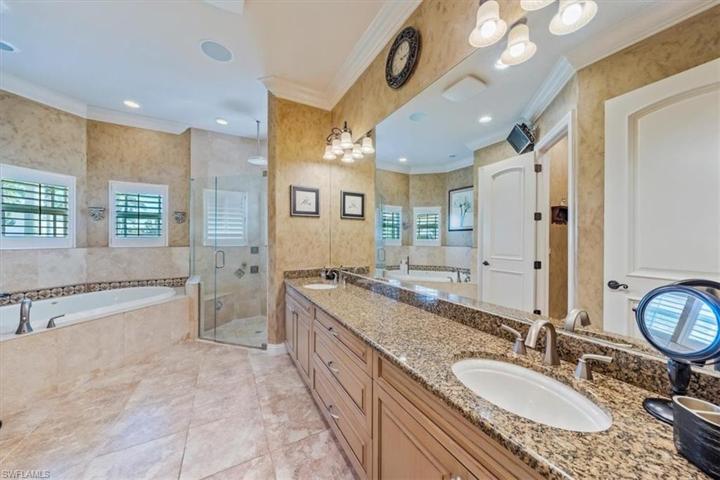 Primary Ensuite Bathroom with dual vanity, separate shower and Jacuzzi tub