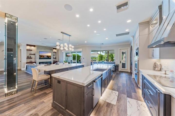 Chef's kitchen & Great room connect seamlessly to outdoors