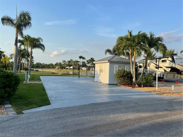 View of front of property with driveway and a front yard