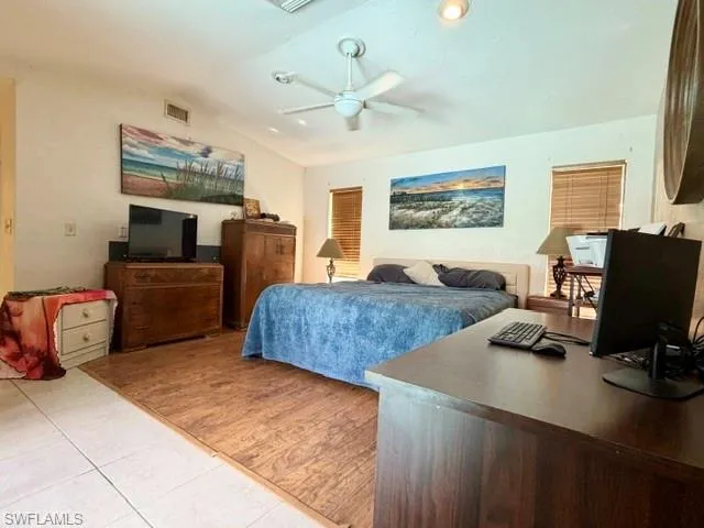 The Master Bedroom with direct pool access through the glass sliders