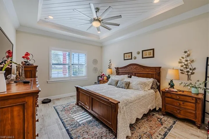 Prime bedroom with two sinks and a 10'-10' walk-in closet