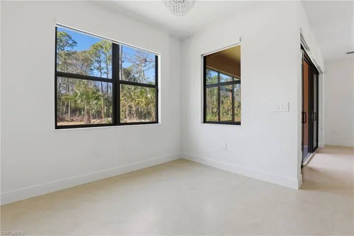 Unfurnished room featuring baseboards