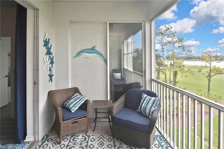 Balcony featuring golf course view