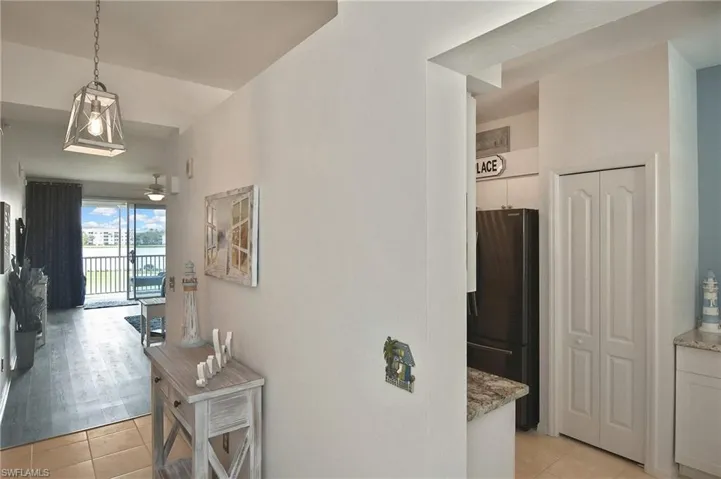 Hallway with light tile patterned floors