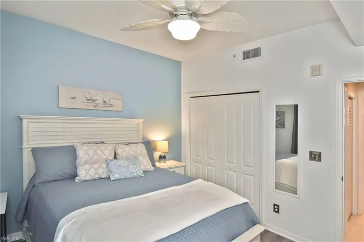 Bedroom featuring a closet, a ceiling fan, and wood finished floors