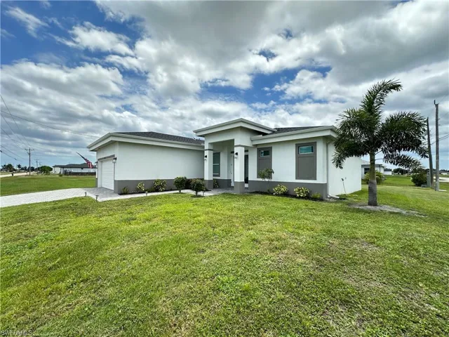 Contemporary stucco exterior with a gray trim base