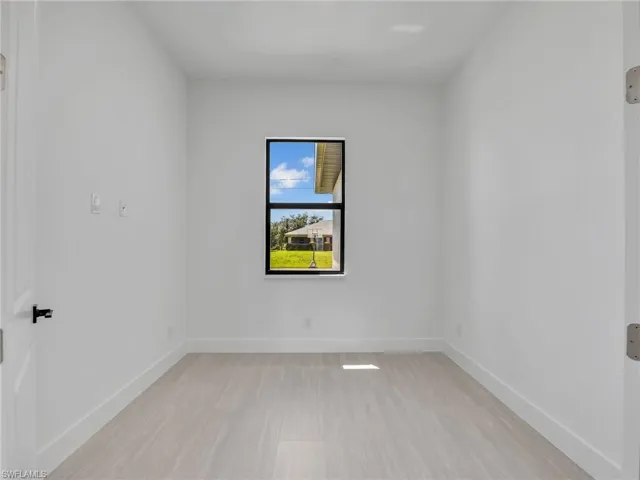 Spare room with baseboards