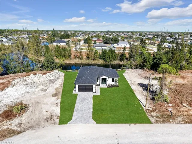Aerial view of residential area with a large body of water