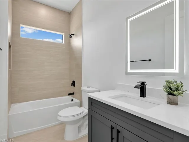 Full bathroom featuring vanity and  shower combination