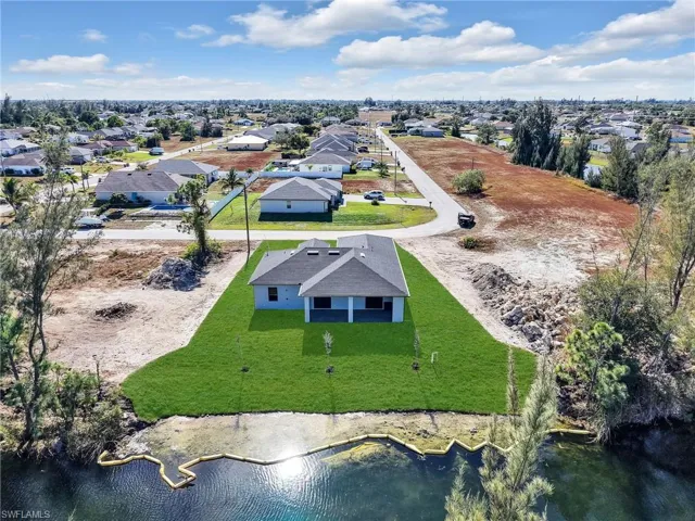 Aerial view of residential area with a large body of water