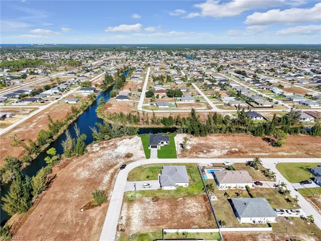 View of property location featuring nearby suburban area and a nearby body of water