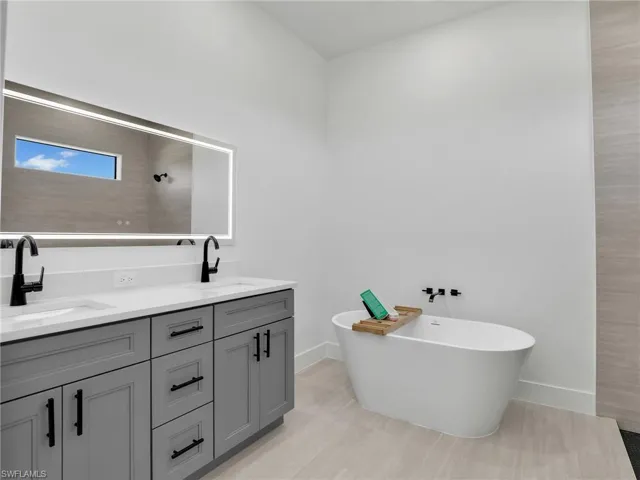 Bathroom with a freestanding tub and double vanity