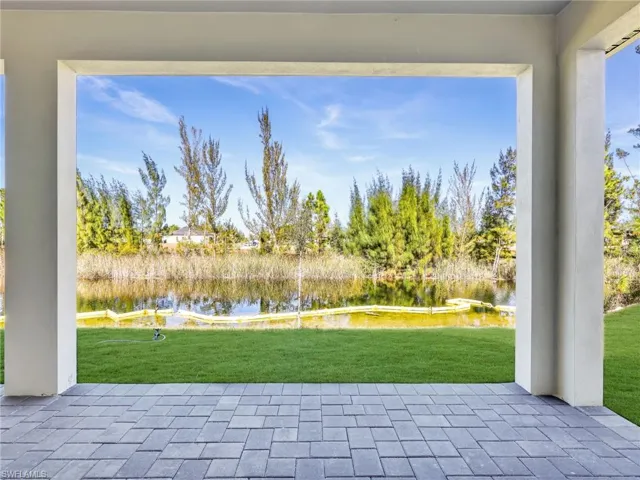 View of patio / terrace with a water view