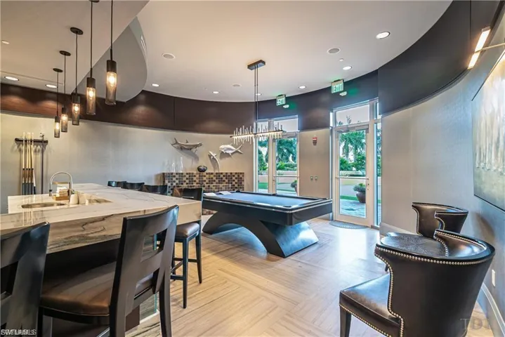Billiards anyone! Game room with fire place, bar and a (full wall) HD interactive golf course simulator.