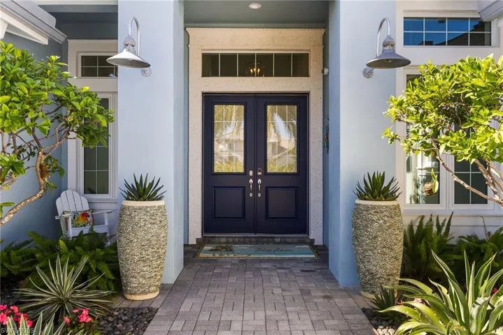 Property entrance featuring french doors
