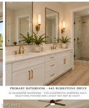 Double vanity featuring white cabinetry, brass hardware, stone-finish countertops with dual undermount sinks, wall-mounted brass fixtures, and a walk-in shower with tile surround