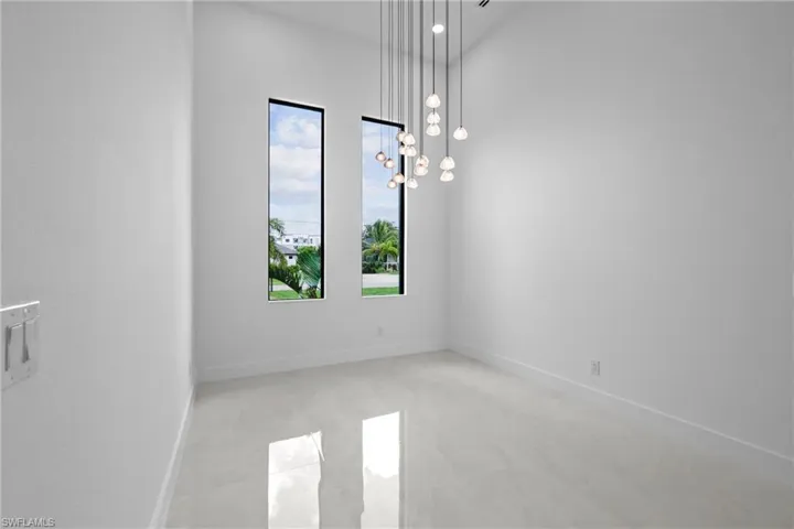 Unfurnished room featuring baseboards and recessed lighting