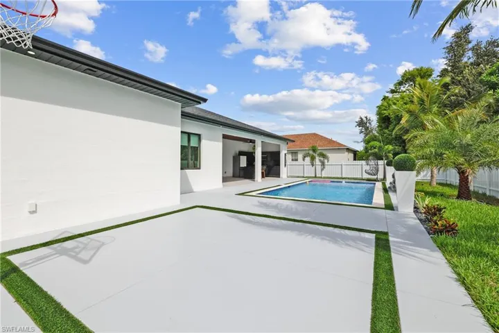 View of swimming pool with a fenced backyard and a patio area
