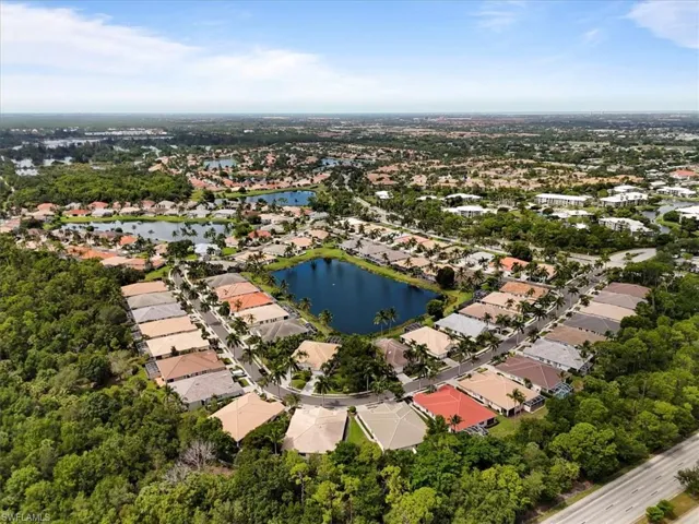 Aerial overview of property's location with nearby suburban area and a large body of water