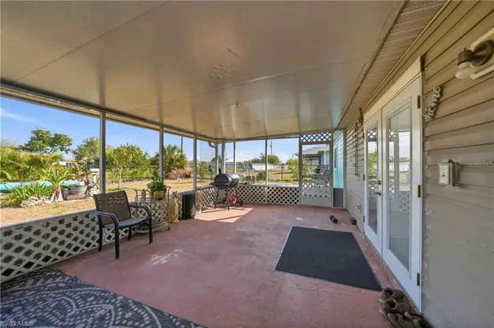 Sunroom / solarium featuring french doors