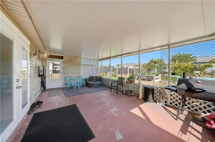 Sunroom / solarium featuring a residential view