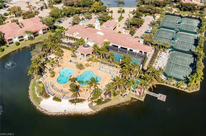 Aerial overview of property's location with a nearby body of water and a pool