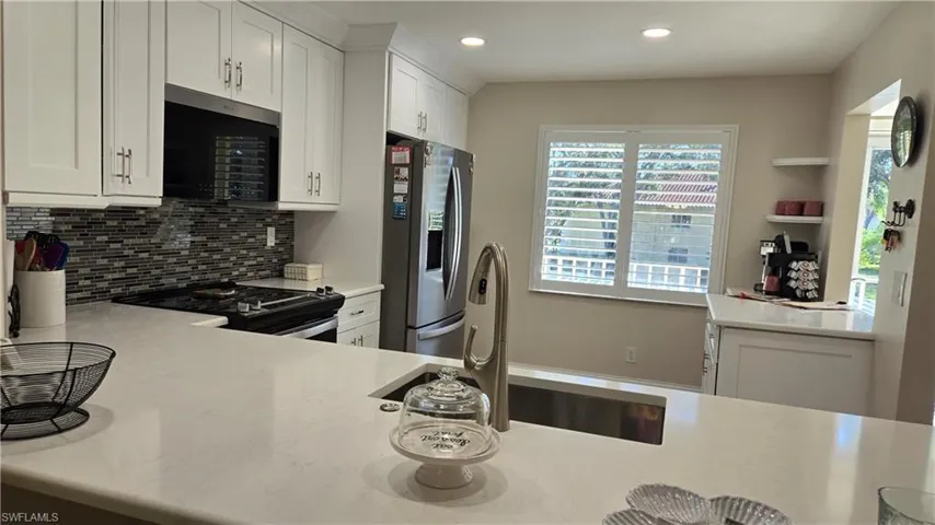 View from dining area shows off the recessed  can lighting